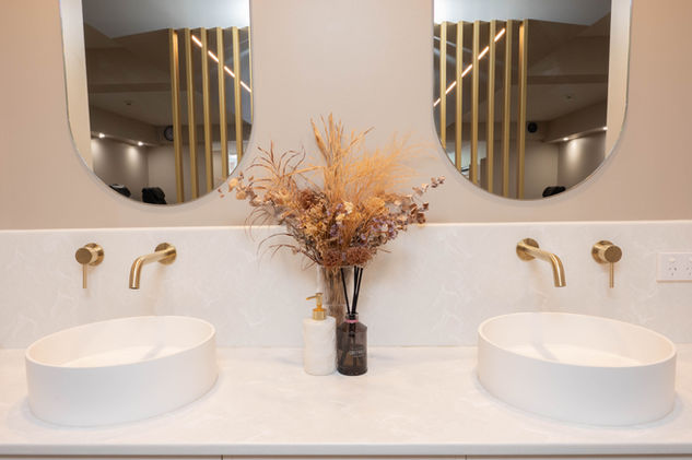 Elegant washbasins and mirrors inside AV Beauty Spa