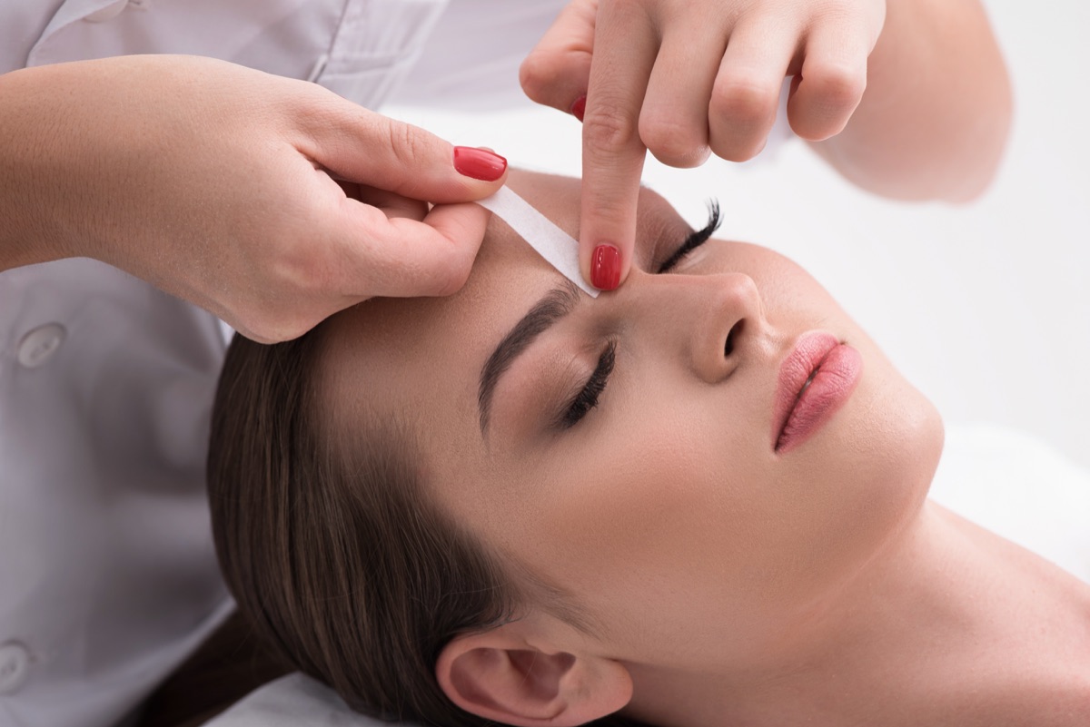 Professional eyebrow waxing treatment